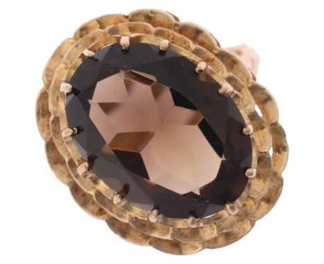 A Vintage 9ct gold smoky quartz dress ring, maker FM, London 1973, set with oval mixed-cut smoky quartz, setting height 24.3m