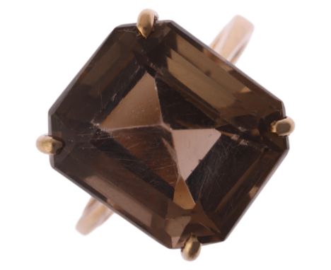 A 9ct gold smoky quartz dress ring, indistinct maker, Birmingham 1998, claw set with octagonal step-cut smoky quartz, setting