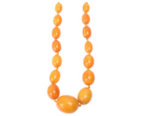 A Vintage single-strand graduated butterscotch amber bead necklace, beads ranging from: 27.1mm - 11.1mm, 52cm, 44.1g . Condit