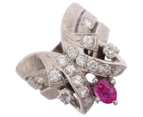 A 14ct white gold ruby and diamond cocktail ring, set with oval mixed-cut ruby, modern round brilliant-cut diamonds and textu