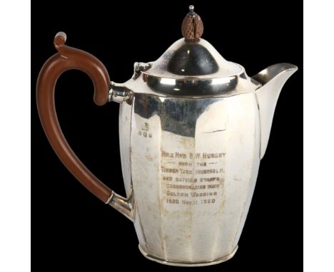 An Art Deco George V silver teapot, Henry Matthews, Birmingham 1929, oval faceted form, with turned mounts, height 20cm, 14.3