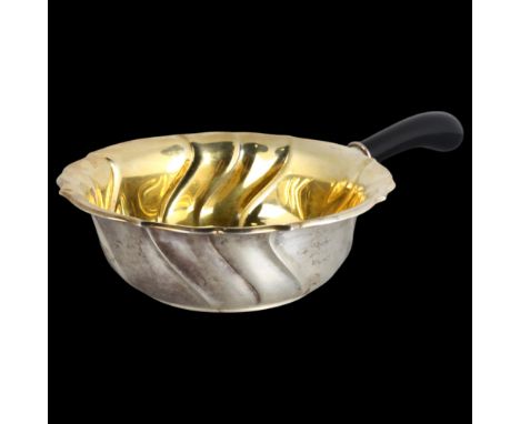 A Danish silver casserole, K C Hermann, circa 1929, circular form with flared scalloped rim, gilt interior and single turned 