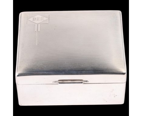 An Art Deco George V silver cigarette box, Walker & Hall, Sheffield 1935, rectangular form with engine turned dome top lid, s