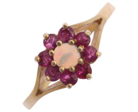 A 9ct gold opal and ruby flowerhead cluster ring, maker J & J, setting height 8.6mm, size N, 1.6g . Condition Report:No damag