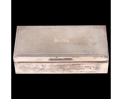 An Elizabeth II silver cigarette box, S J Rose & Son, London 1957, rectangular form, with engine turned lid and sandalwood li
