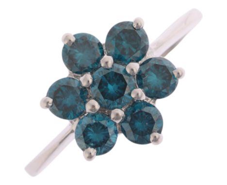 An 18ct white gold blue diamond flowerhead cluster ring, maker DK, Birmingham 2007, claw set with modern round brilliant-cut 