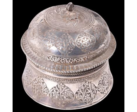 An Indian Mughal silver pandan/betel box and cover, circular form with relief embossed floral decoration, diameter 9cm, 7.3oz