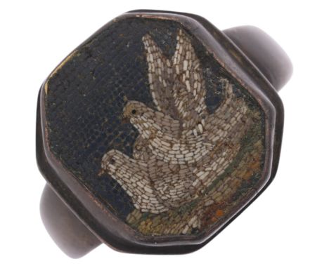 An Antique micro-mosaic 'Doves' panel ring, the octagonal panel set with cemented tesserae depicting 2 nesting doves, mounted
