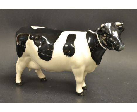 A Beswick Fresian cow, ch "Claybury Legwater", designed by Arthur Gredington, model no 1326A, black and white gloss, 12cm hig