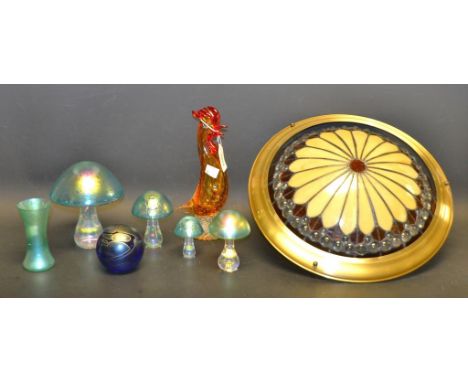 An iridescent glass mushroom, three others smaller; a Maltese glass paperweight; a Murano cockerel; a decorative glass celing