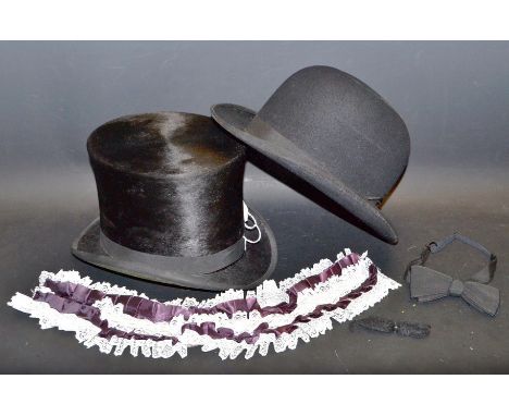 A silk top hat by Norton & co. Worcester; a bowler hat by A. Wright & sons; a ladys lace and silk garter; a black silk tie; a