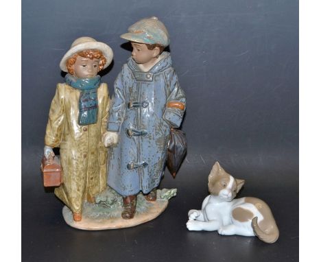 A Lladro model Off To School, No12242;  another Suprised Cat, No05114, both boxed (2)