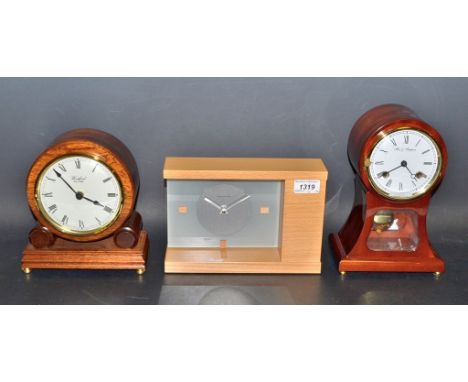 Clocks - a Fox & Simpson balloon clock;  a Woodford oak cased mantel clock;  an other Hermle (3)