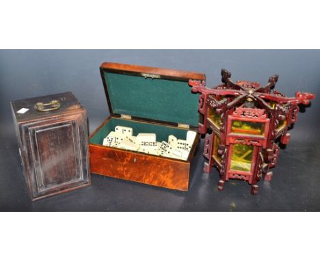 A wooden box with sliding cover and handles;  another veneered with hinged cover containing dominoes;  oriental style wooden 