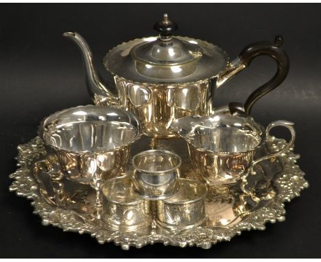 A three piece plated tea service on a circular tray; a pair of silver napkin rings, Birmingham; another 40g (7)