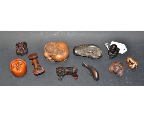 A Japanese netsuke foe dog; others, fish, skeleton, monkey, etc.