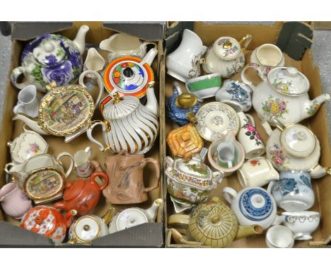 A Derby Crown bachelor cream jug; teapots,cream jugs, sucrier and sugar bowls including Royal Doulton, Sadler; Leonardo, Orie