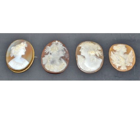 A 19th century oval carverd shell cameo brooch, brass mounted; three other 19th century carved shell cameo portrait panels, a