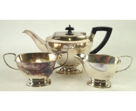 AN ELECTROPLATE TEA SERVICE OF 3 PIECES, of plain rounded oblong and tapering form and raised on rounded oblong pedestal base