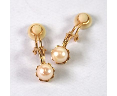 A PAIR OF 9ct GOLD CLIP EARRINGS, each with a single pearl in a cup setting, 3.5gms gross (2) 