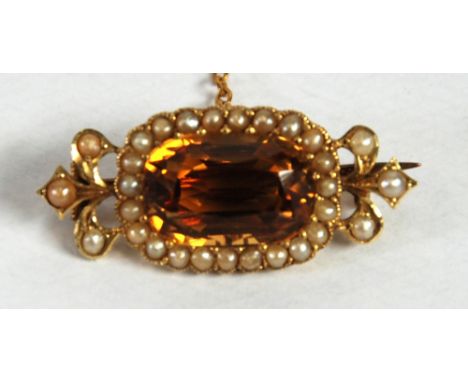 LATE VICTORIAN/EDWARDIAN UNMARKED GOLD, probably citrine and seed pearl set BROOCH with safety chain, 4.5 gms