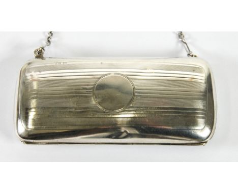 GEORGE V LADY'S ENGINE TURNED SILVER EVENING BAG, of rounded oblong form with green silk lined interior (a.f.) and a chain su