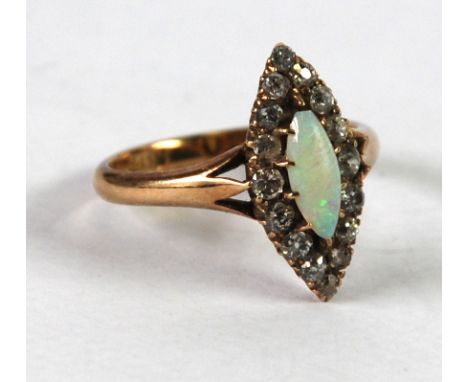 LATE VICTORIAN 18ct GOLD, OPAL AND DIAMOND MARQUISE RING, set with centre lozenge shaped opal and surround of sixteen old cut