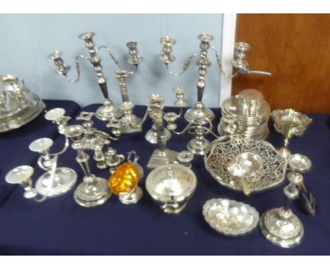 A SELECTION OF ELECTROPLATE TO INCLUDE; PAIR OF CANDLESTICKS, CANDELABRA, a pierced swing handled  CAKE BASKET, a number of p