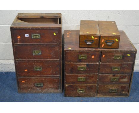 TWO DISTRESSED EARLY TO MID 20TH CENTURY OAK OFFICE DRAWERS, with brass campaign handles, one made up of eights drawers, widt