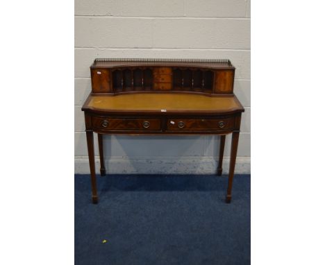 A REPRODUCTION MAHOGANY LADIES DESK, with a tan leather inlay, two frieze drawers, on square tapering legs and spade feet, wi