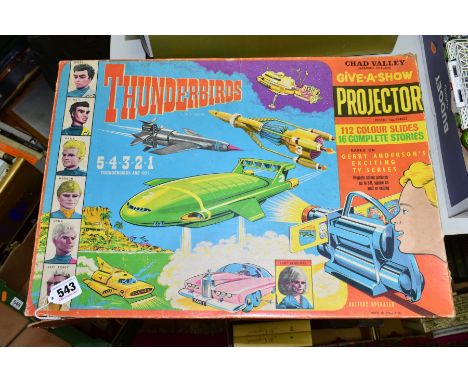 A BOXED CHAD VALLEY THUNDERBIRDS GIVE-A-SHOW PROJECTOR, NO. G347R, appears complete with all sixteen sets of slide strips whi