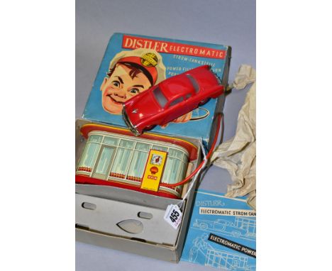 A BOXED DISTLER ELECTROMATIC POWER FILLING STATION AND STUDBAKER COMMANDER CAR, not tested, complete with tinplate and plasti