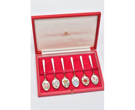 A CASED SET OF SIX SILVER ENAMELLED COFFEE SPOONS, each silver gilt spoon has a decorative floral enamelled motif bowl, hallm