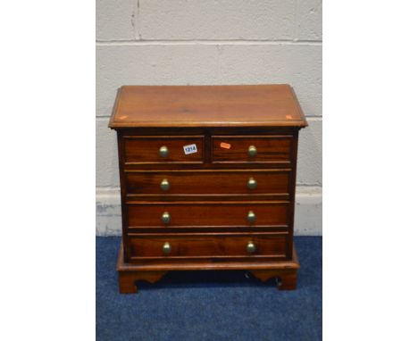 A SMALL HARDWOOD CHEST OF TWO SHORT OVER THREE LONG DRAWERS, brass turned handles, on bracket feet, width 50cm x depth 31cm x