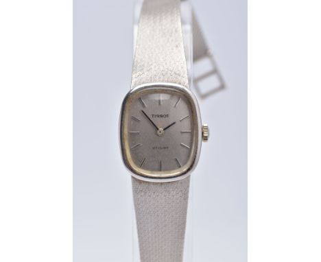 A LADIES 14CT WHITE GOLD TISSOT WRISTWATCH, rounded square silver dial signed 'Tissot Stylist', baton markers, silver tone ha