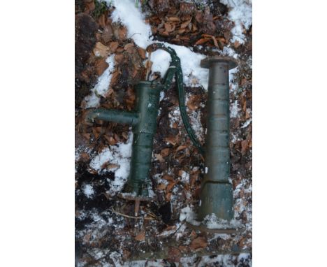 A VINTAGE WATER PUMP, green painted, on a matching separate pillar (dismantled)