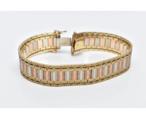 A 9CT TRI-COLOURED GOLD WIDE FLAT LINK BRACELET, designed with textured yellow, rose and white coloured gold links, fitted wi