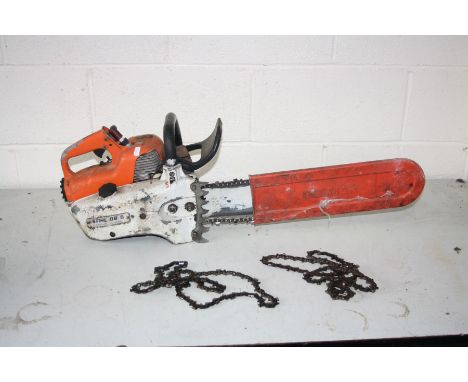 A STIHL O8 S PETROL CHAINSAW (engine pulls freely but hasn't been started) with 2 spare blades (3)