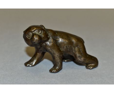 A JAPANESE BRONZE OF A MACAQUE ON ALL FOURS, indistinct character marks to the belly, 112.6 grams, length 6cm x height 4cm, s