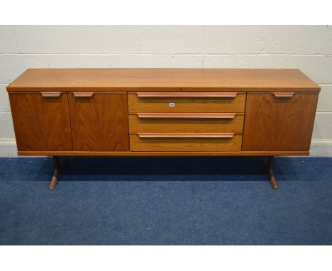 AN EARLY TO MID 20TH CENTURY TEAK SIDEBOARD, with double cupboard doors, a fall front door, both flanking three drawers, the 