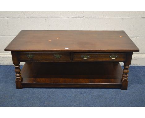 A REPRODUCTION OAK COFFEE TABLE, with two drawers and undershelf, width 122cm x 61cm x height 47cm