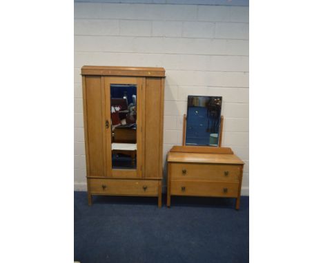 AN EARLY TO MID 20TH CENTURY GOLDEN OAK TWO PIECE BEDROOM SUITE, comprising a single mirror door wardrobe above a single draw