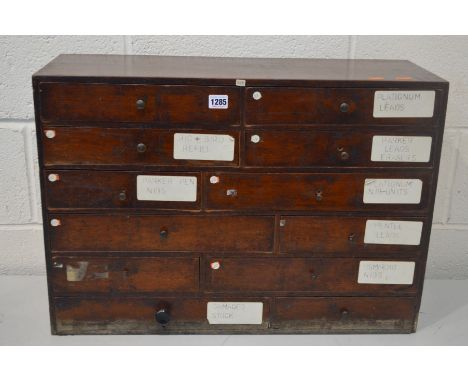A SMALL EARLY TO MID 20TH CENTURY STAINED MAHOGANY OFFICE BANK OF TWELVE ASSORTED DRAWERS, oak lined drawers, with interior d