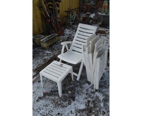 FOUR WHITE PLASTIC FOLDING GARDEN CHAIRS AND A SMALL TABLE and a small quantity of garden tools