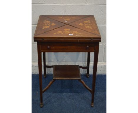 AN EDWARDIAN MAHOGANY AND MARQUETRY INLAID ENVELOPE CARD TABLE, with a baize interior, single frieze drawer, on square taperi