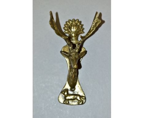 A SMALL GILT METAL STAG'S HEAD DOOR KNOCKER, the backplate cast with wheatsheaf and dog, height 15cm