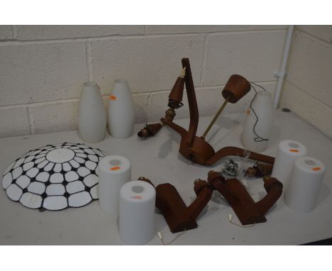 A RETRO TEAK THREE BRANCH CEILING LIGHT, with white glass shades, along with a pair of teak wall lights, with glass shades, a