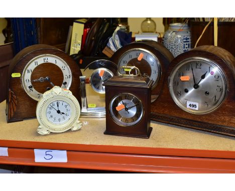 SIX ASSORTED MANTEL CLOCKS AND AN OAK CASED BAROMETER, including three oak cased dome top mantel clocks, one with loose glass