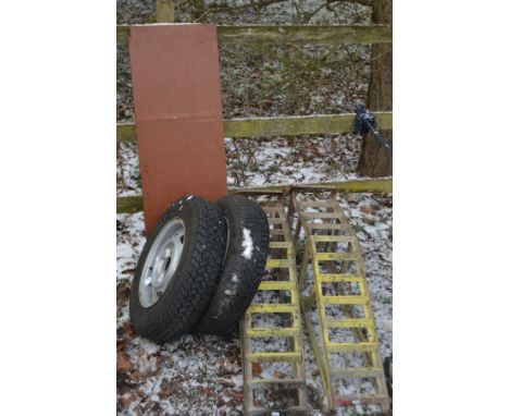 A PAIR OF METAL CAR RAMPS, together with a two 14inch car wheel with tyres, and a wooden shelf (5)