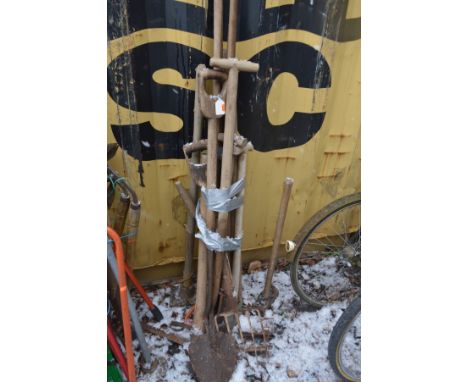 A BUNDLE OF VINTAGE GARDEN TOOLS, to include shovels, forks, pick axes, etc